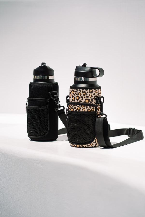 Insulated stainless steel drink bottle with straw lid and storage sleeve in leopard print or black